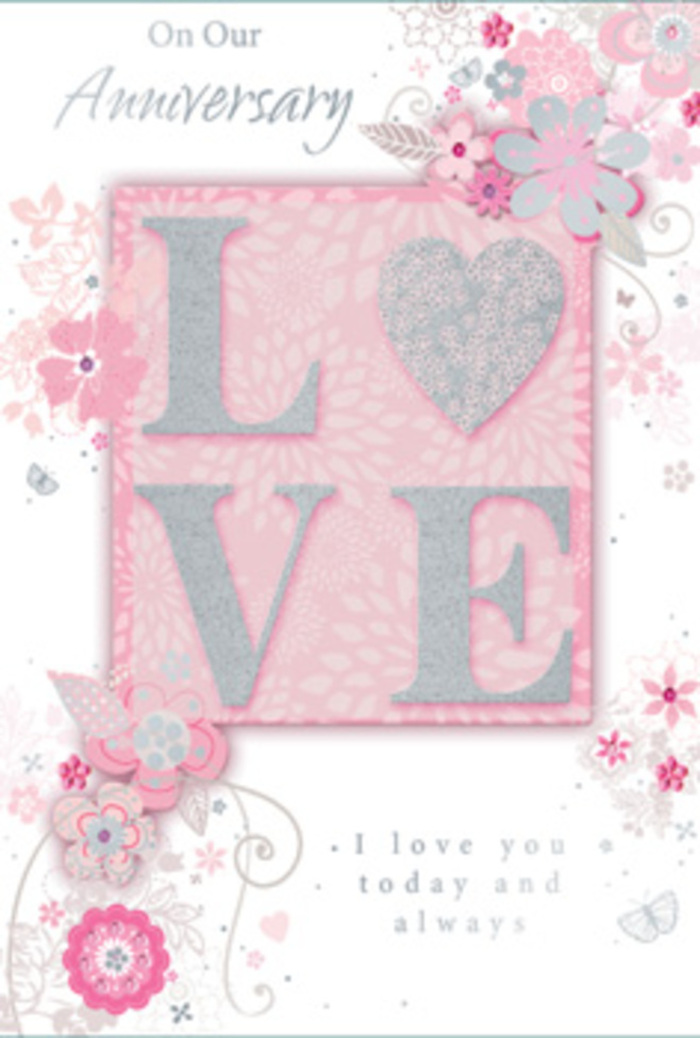 This anniversary card opens like a gentle breath of light in a Colney Hatch sitting room, where love is part of the everyday rhythm. Dominating the design is the word LOVE, rendered in an elegant, raised print dusted with frosted glitter that glimmers delicately when it catches the light, much like the soft sheen on pale pink petals arranged by Colney Hatch Flowers. The lettering feels distinctly tactile, as though it has been carefully layered, inviting hands to explore its contours. Around this central motif, a border of wispy, hand-drawn blossoms and slender sprays of leaves drifts gracefully across the card. Their hues mingle in harmony-blush pinks, blush-ivory tones, traces of lilac and gentle greys-creating a soothing, romantic palette reminiscent of pastel bouquets seen in windows along nearby residential streets. Fine filigree flourishes, curling tendrils and tiny, almost-hidden butterflies appear among the foliage, suggesting the flutter of nerves and excitement that still lingers even after many anniversaries. The text I love you today and always is set in understated, flowing type, its simplicity balancing the decorative detail around it. The background is a soft, powdery pink, diffused like early morning light through sheer curtains, giving the entire card a sense of warmth and calm. Every illustrated flower and swirl has been placed with the same care a florist uses when turning stems and leaves into a hand-tied bouquet, resulting in a keepsake that feels as thoughtful and personal as a freshly delivered arrangement in Colney Hatch.